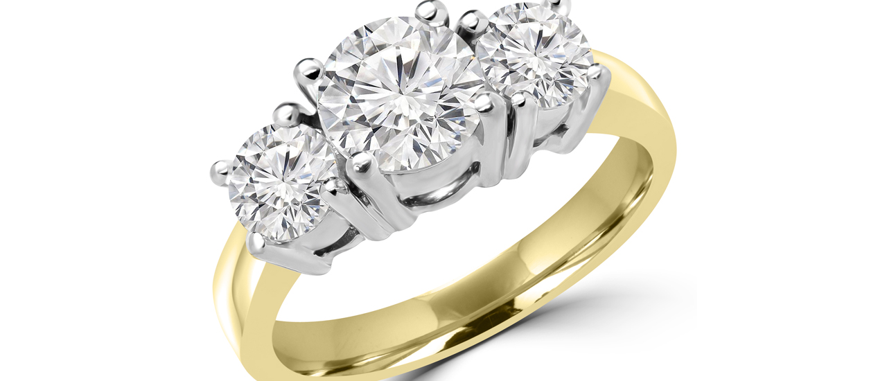 Three-stone yellow gold engagement ring
