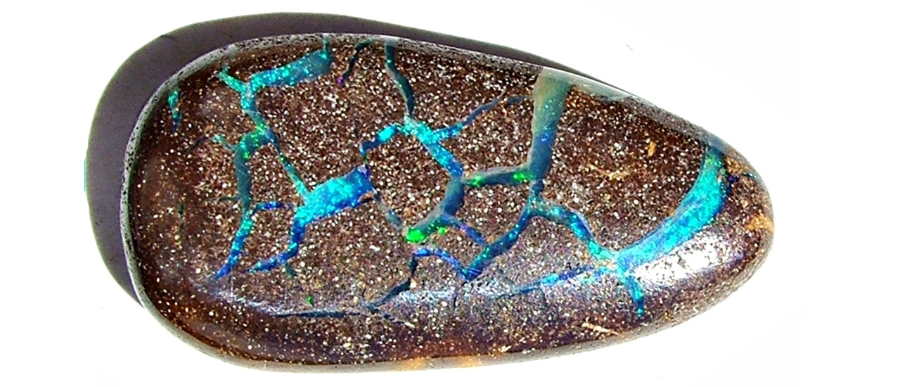 Opal commands attention with vibrant blues and greens!