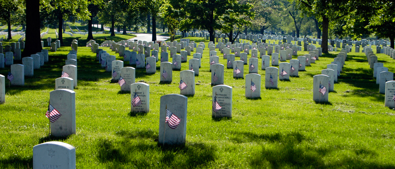 Flags mark graves of fallen soldiers.